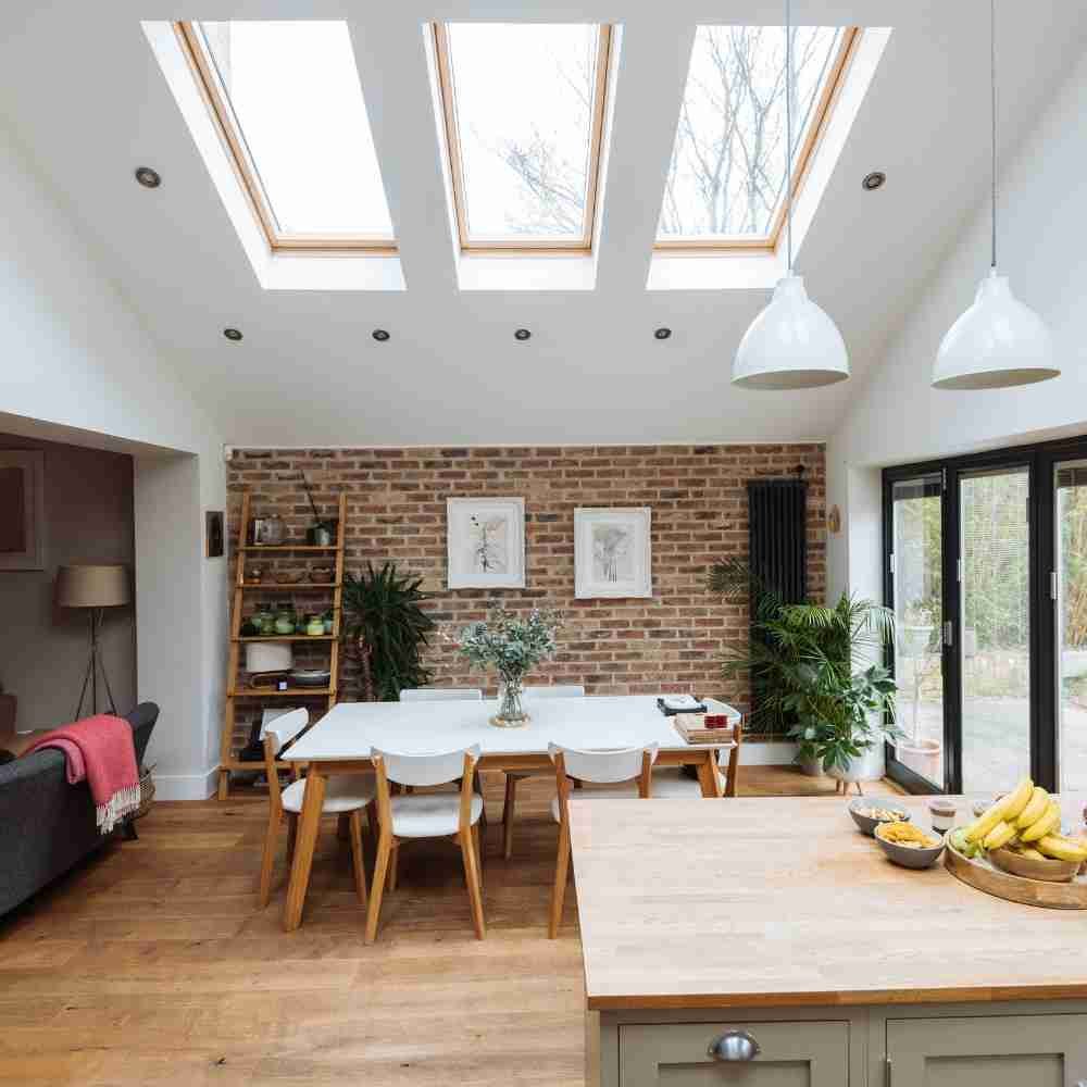 Illustrative kitchen and dining extension with rooflights and exposed brick