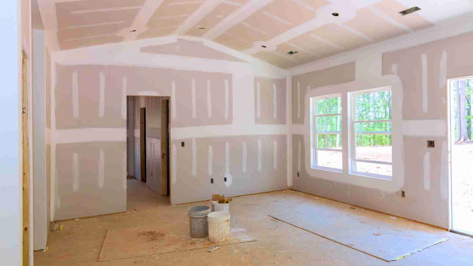 Illustrative interior renovation with newly fitted plasterboard and jointing work